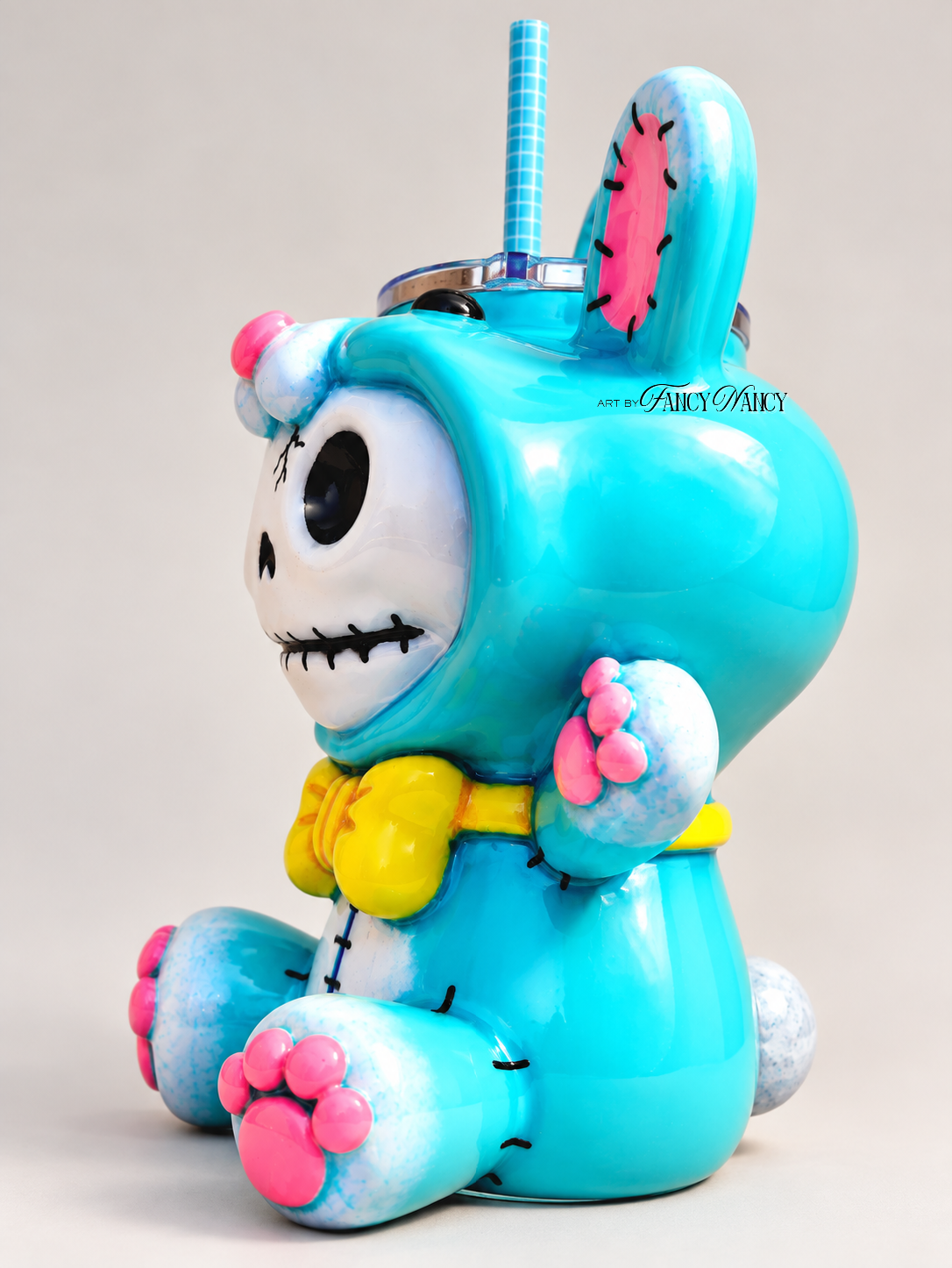 Opposite three-quarter view of turquoise hand-sculpted Funny Bunny 3D tumbler