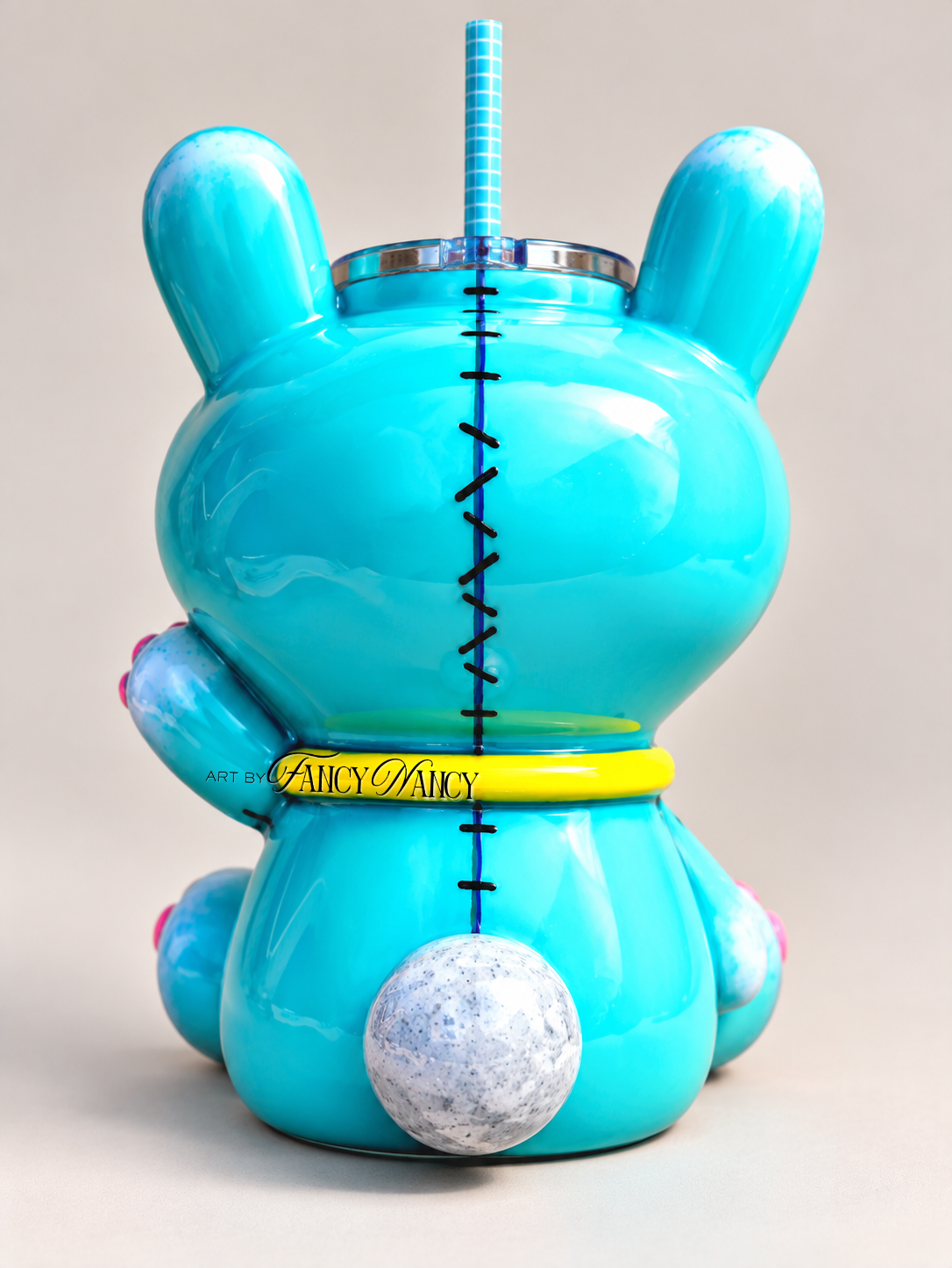 Back view of hand-sculpted Funny Bunny 3D tumbler showing stitched details and bunny tail